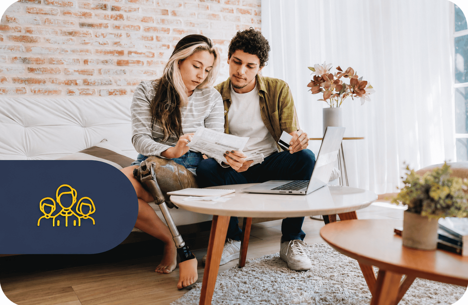 Couple reviewing finances with laptop and documents